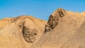 Sandy mountain peaks on a blue sky