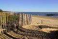 Sandy ocean beach fence pathway to protect sand dune and access water sea Royalty Free Stock Photo