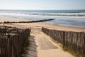 Sandy ocean path way access to sand beach sea with wooden fence in summer day Royalty Free Stock Photo