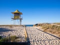 Sandy pathway entrance to the beach lifeguard tower, wooden rails Gold Coast Australia Royalty Free Stock Photo