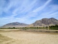 The sandy river bank of the North Thompson river in the beautiful dry landscape of Kamloops, British Columbia, Canada. Royalty Free Stock Photo