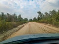 sandy road passed by the grader. Drive on a dirt road Royalty Free Stock Photo