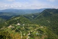 Sandy road and small old village houses in caucasus mountains Royalty Free Stock Photo