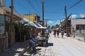 Sandy road with tourists and stalls on holbox island, quintana r