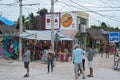 Sandy road with tourists and stalls on Holbox Island, Quintana Roo, Mexico located in north yucatan peninsula