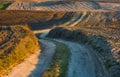 Sandy rural road and plowed fields Royalty Free Stock Photo