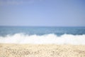 Sandy sea beach on clear summer day. Selective focus. Soft waves of blue sea on tropical beach with white sand. Ocean background Royalty Free Stock Photo