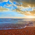 Sandy sea bech at the sunset