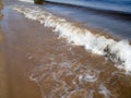 A sandy shore . River surf. A Sunny summer day Royalty Free Stock Photo