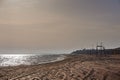 Sandy shore at sea with an observation tower