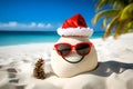 Sandy snowman. Creative Xmas and New Year background. Imitation of sandy Christmas snowman in red santa hat and sunglasses at Royalty Free Stock Photo