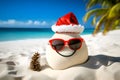 Sandy snowman. Creative Xmas and New Year background. Imitation of sandy Christmas snowman in red santa hat and sunglasses at