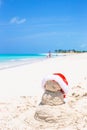 Sandy snowman with red Santa Hat on white Royalty Free Stock Photo