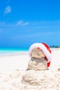 Sandy snowman with red Santa Hat on white Royalty Free Stock Photo