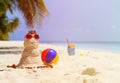 Sandy snowman and toys at sand beach Royalty Free Stock Photo