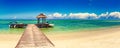 Sandy tropical beach. Jetty on the foreground. Panorama Royalty Free Stock Photo