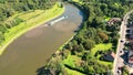 Sandy Voyage: Aerial view of Cargo Ship Amidst Green Dikes