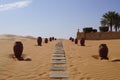 Sandy walk with stones in Qasr Al Sarab desert resort in Abu Dhabi, the United Arab Emirates