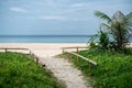 Sandy walkway to the sea beach on blue sky background Royalty Free Stock Photo