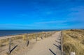 Sandy way on top of the dunes, leading along the beach