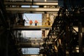 Coal Fired Power Plant Project. Worker standby at building bridge.