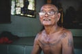 Cambodian buddhist monk with tatoos at temple Wat Krabi Riel Pagoda, Siem Reap Province, Cambodia