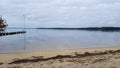 Sanguinet lake sand beach water in cloudy day