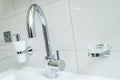 Sanitary with with chromium faucet and white bathroom
