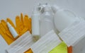 Sanitary medical background. Disinfectants, detergents, antiseptic, cleaning wipes and masks are laid out on a white background.