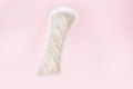 Sanitary napkin or sanitary pad for intimate hygiene on a pink background Royalty Free Stock Photo