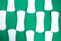 sanitary napkin pattern on dark green background