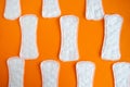sanitary napkin pattern on orange background
