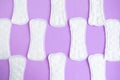 Sanitary napkin pattern on purple background