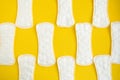 Sanitary napkin pattern on yellow background
