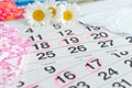 Sanitary pads, calendar, towel and pink flower on light background