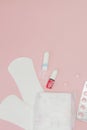 Sanitary pads and tampons and pills on pink background. Woman critical days, gynecological menstruation cycle. Menstruation Royalty Free Stock Photo