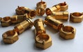 Male Brass Water Meter Fittings And Union Nuts Laid Out In The Form Of Flower On White Surface Royalty Free Stock Photo