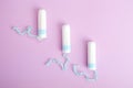 Sanitary tampon isolated on pink background. Beauty and hygiene concept