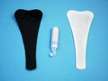 Sanitary white and black napkins for woman, menstrual pads. Menstruation cycle. Hygiene and protection