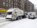 Sanitation truck shoves snow off Bronx street in NY