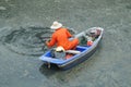 Sanitation workers clean up the rubbish in the river