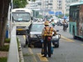 Sanitation workers in the removal of roadside weeds