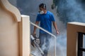 Sanitization from viruses. a man in a respirator sprays an antiseptic
