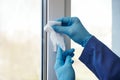 Sanitizer disinfection of handles on windows and doors in rooms