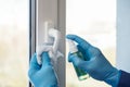 Sanitizer disinfection of handles on windows and doors in rooms