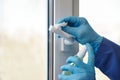 Sanitizer disinfection of handles on windows and doors in rooms