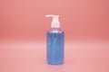 sanitizer gel pump dispenser. Clear sanitizer in pump bottle, for killing germs, bacteria and virus. isolate on Pink background Royalty Free Stock Photo