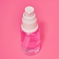 Sanitizer spray with pink liquid, hygiene product close-up. A means for washing hands in a pandemic coronavirus