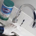 Sanitizing a Sink with Clorox Disinfecting Wipes Royalty Free Stock Photo