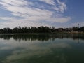 Sanjay Lake reflecting trees and clouds